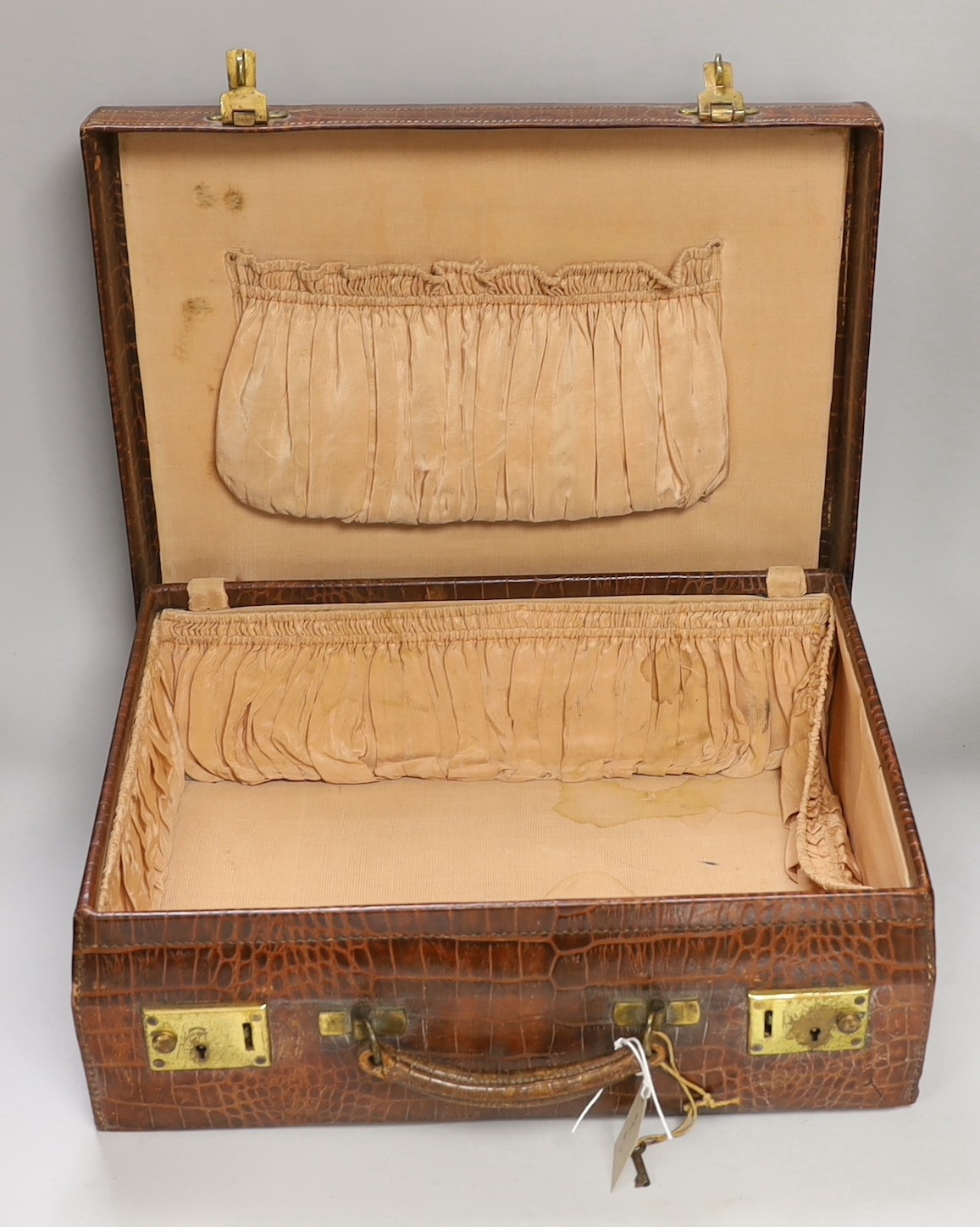 A George V crocodile skin toilet case